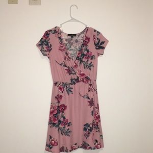A pink floral dress with a long V-neck.